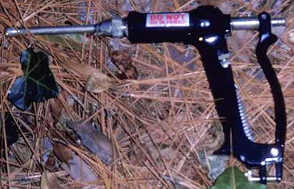 Figure 11. A spot gun for delivering metered volumes of herbicid